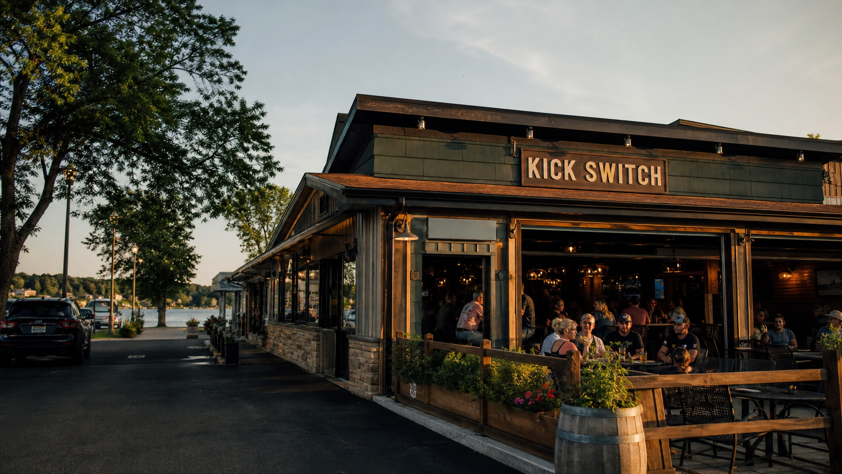 Lake-area bar and grill exterior with patio seating near Okauchee Lake